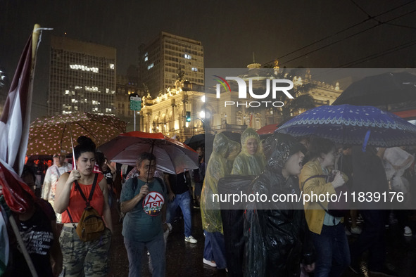 Demonstrators shout slogans as they participate in a protest against Sao Paulo's governor, Tarcisio de Freitas, and the violence of the poli...