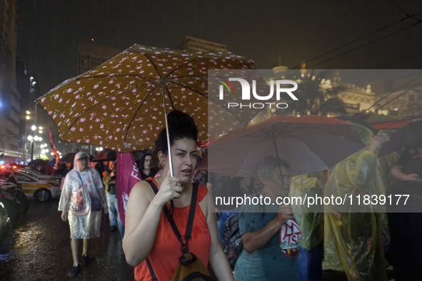 Demonstrators shout slogans as they participate in a protest against Sao Paulo's governor, Tarcisio de Freitas, and the violence of the poli...