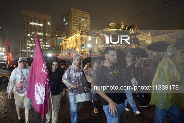 Demonstrators shout slogans as they participate in a protest against Sao Paulo's governor, Tarcisio de Freitas, and the violence of the poli...