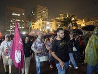 Demonstrators shout slogans as they participate in a protest against Sao Paulo's governor, Tarcisio de Freitas, and the violence of the poli...