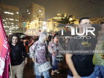 Demonstrators shout slogans as they participate in a protest against Sao Paulo's governor, Tarcisio de Freitas, and the violence of the poli...