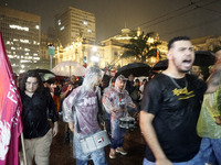 Demonstrators shout slogans as they participate in a protest against Sao Paulo's governor, Tarcisio de Freitas, and the violence of the poli...