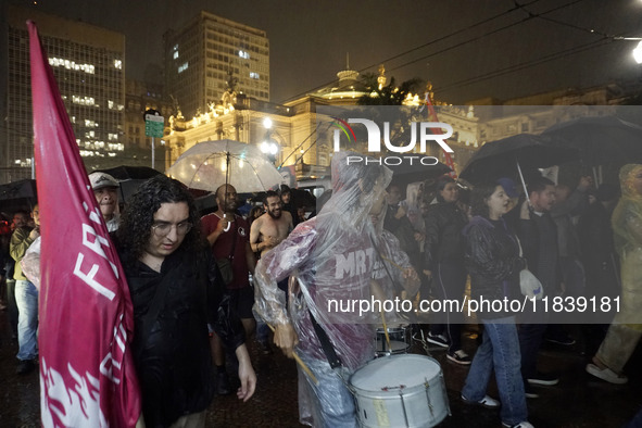 Demonstrators shout slogans as they participate in a protest against Sao Paulo's governor, Tarcisio de Freitas, and the violence of the poli...