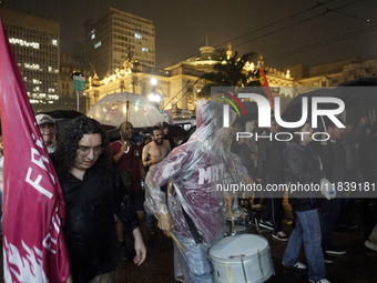 Demonstrators shout slogans as they participate in a protest against Sao Paulo's governor, Tarcisio de Freitas, and the violence of the poli...