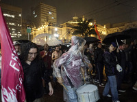 Demonstrators shout slogans as they participate in a protest against Sao Paulo's governor, Tarcisio de Freitas, and the violence of the poli...