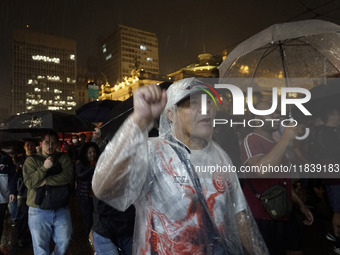 Demonstrators shout slogans as they participate in a protest against Sao Paulo's governor, Tarcisio de Freitas, and the violence of the poli...