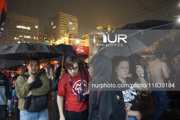 Demonstrators shout slogans as they participate in a protest against Sao Paulo's governor, Tarcisio de Freitas, and the violence of the poli...