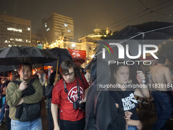 Demonstrators shout slogans as they participate in a protest against Sao Paulo's governor, Tarcisio de Freitas, and the violence of the poli...