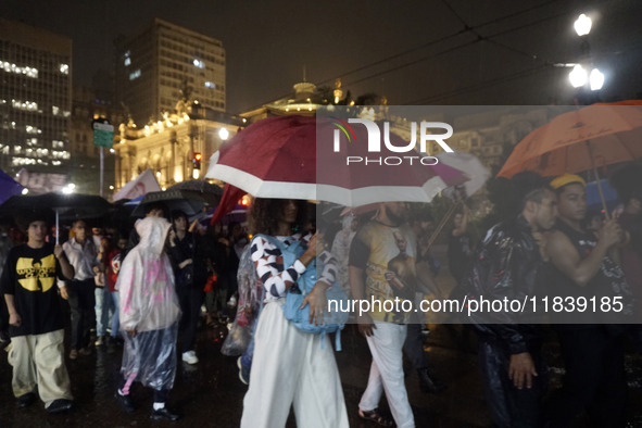 Demonstrators shout slogans as they participate in a protest against Sao Paulo's governor, Tarcisio de Freitas, and the violence of the poli...