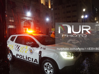 Demonstrators shout slogans as they participate in a protest against Sao Paulo's governor, Tarcisio de Freitas, and the violence of the poli...