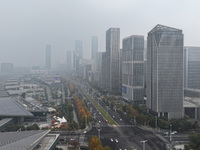 High-rise buildings loom amid heavy fog in Nanjing, Jiangsu province, China, on December 6, 2024. (