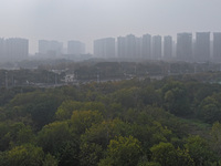 High-rise buildings loom amid heavy fog in Nanjing, Jiangsu province, China, on December 6, 2024. (