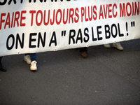 The banner reads 'Doing always more with always less, we're fed up'. Between 8,000 and 10,000 protesters march in Toulouse, France, on Decem...