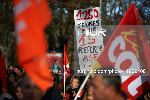 A placard reads '1250 youths for only 15 specialists at the child welfare service'. Between 8,000 and 10,000 protesters march in Toulouse, F...