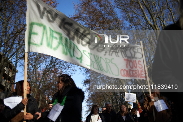 A banner reads 'you, me, us, families, children, seniors, all affected'. Between 8,000 and 10,000 protesters march in Toulouse, France, on D...