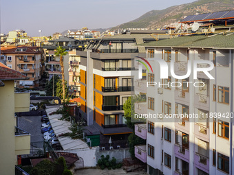 Dense urban development with hotels squeezed between residential buildings is seen in Alanya, Turkey, on November 3, 2024. (