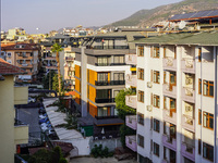 Dense urban development with hotels squeezed between residential buildings is seen in Alanya, Turkey, on November 3, 2024. (