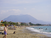 Tourists relax on beach loungers on the beach of the Mediterranean Sea in Alanya, Turkey, on November 3, 2024 (