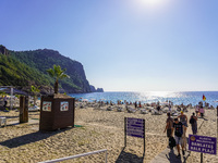 Tourists relax on Damlatas Beach of the Mediterranean Sea in Alanya, Turkey, on November 3, 2024 (