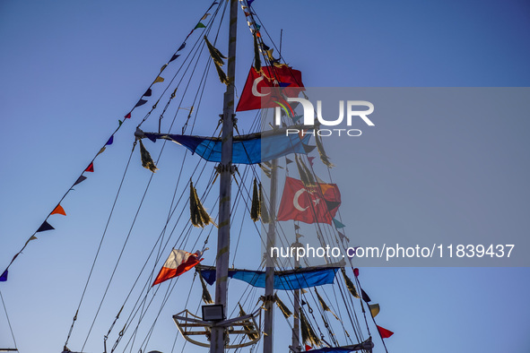 Turkish flags on a tourist ship wave in Alanya, Turkey, on November 6, 2024. 