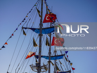 Turkish flags on a tourist ship wave in Alanya, Turkey, on November 6, 2024. (