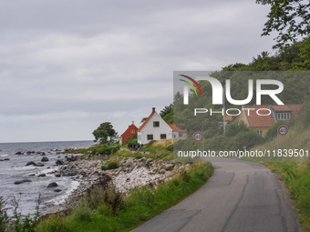 The Baltic Sea coast with a few houses is seen near Hasle, Bornholm Island, Denmark, on August 5, 2024. (