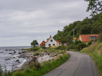 The Baltic Sea coast with a few houses is seen near Hasle, Bornholm Island, Denmark, on August 5, 2024. (