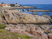 The rocky coast of the Baltic Sea is seen in Gudhjem, Bornholm Island, Denmark, on August 6, 2024. (