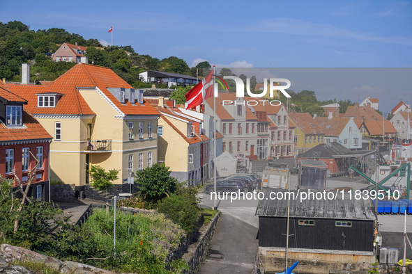 A general view of the city and port with the Danish flag in the wind is seen in Gudhjem, Bornholm Island, Denmark, on August 6, 2024. 