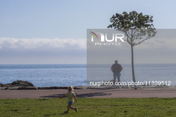 A man looks at the sea on the Baltic Sea coast in Gudhjem, Bornholm Island, Denmark, on August 6, 2024. 