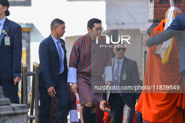 Bhutanese King Jigme Khesar Namgyel Wangchuk (center) arrives at Swayambhunath Stupa, a UNESCO World Heritage Site, during a five-hour trans...