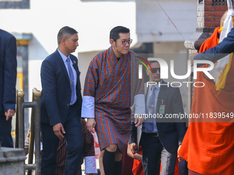 Bhutanese King Jigme Khesar Namgyel Wangchuk (center) arrives at Swayambhunath Stupa, a UNESCO World Heritage Site, during a five-hour trans...