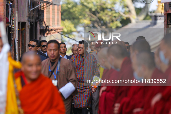 Bhutanese King Jigme Khesar Namgyel Wangchuk (center) arrives at Swayambhunath Stupa, a UNESCO World Heritage Site, during a five-hour trans...