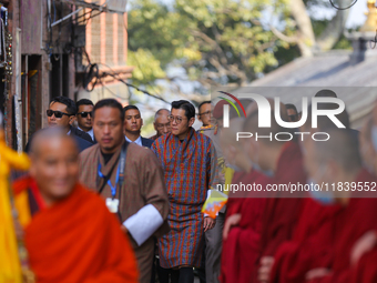 Bhutanese King Jigme Khesar Namgyel Wangchuk (center) arrives at Swayambhunath Stupa, a UNESCO World Heritage Site, during a five-hour trans...