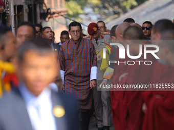 Bhutanese King Jigme Khesar Namgyel Wangchuk (center) is welcomed by monks at Swayambhunath Stupa, a UNESCO World Heritage Site, as he spend...