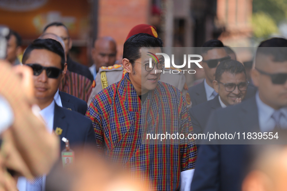 Bhutanese King Jigme Khesar Namgyel Wangchuk (center) arrives at Swayambhunath Stupa, a UNESCO World Heritage Site, during a five-hour trans...