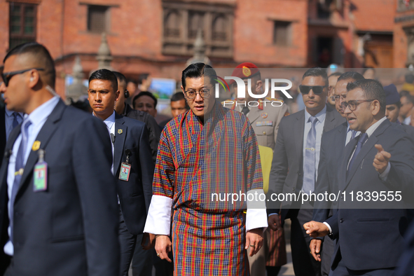 Bhutanese King Jigme Khesar Namgyel Wangchuk (center) tours Swayambhunath Stupa, a UNESCO World Heritage Site, during a five-hour transit in...