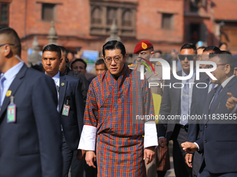 Bhutanese King Jigme Khesar Namgyel Wangchuk (center) tours Swayambhunath Stupa, a UNESCO World Heritage Site, during a five-hour transit in...