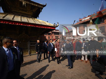 Bhutanese King Jigme Khesar Namgyel Wangchuk (center) tours Swayambhunath Stupa, a UNESCO World Heritage Site, during a five-hour transit in...