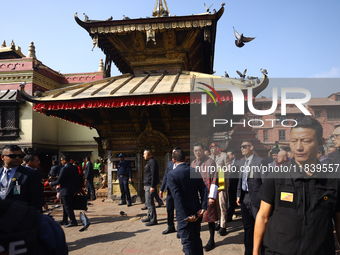 Bhutanese King Jigme Khesar Namgyel Wangchuk (center) tours Swayambhunath Stupa, a UNESCO World Heritage Site, during a five-hour transit in...