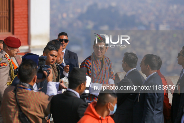 Bhutanese King Jigme Khesar Namgyel Wangchuk (center) overlooks the Kathmandu Valley from the viewpoint at Swayambhunath Stupa, a UNESCO Wor...