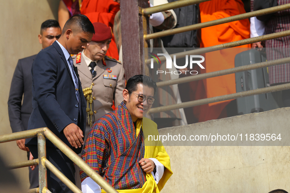 Bhutanese King Jigme Khesar Namgyel Wangchuk (center) tours Swayambhunath Stupa, a UNESCO World Heritage Site, during a five-hour transit in...