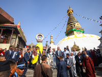 Bhutanese King Jigme Khesar Namgyel Wangchuk (wearing a yellow robe) tours around Swayambhunath Stupa, a UNESCO World Heritage Site, during...