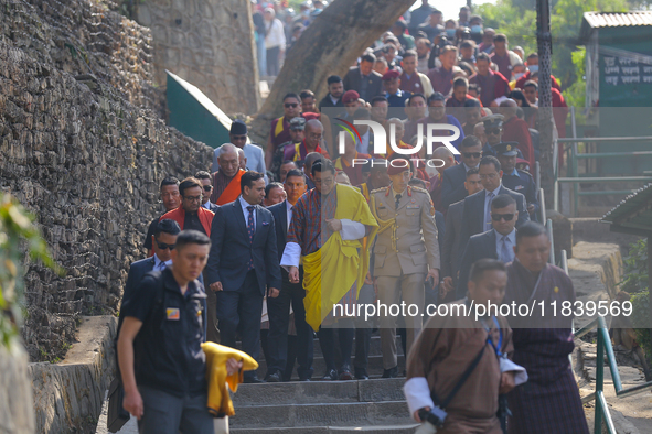 Bhutanese King Jigme Khesar Namgyel Wangchuk (wearing a yellow robe) tours around Swayambhunath Stupa, a UNESCO World Heritage Site, during...