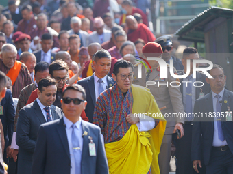 Bhutanese King Jigme Khesar Namgyel Wangchuk (center) tours Swayambhunath Stupa, a UNESCO World Heritage Site, during a five-hour transit in...