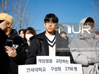 A group of dozens of current students and alumni from Yonsei University holds a press conference condemning President Yoon Suk-yeol's martia...