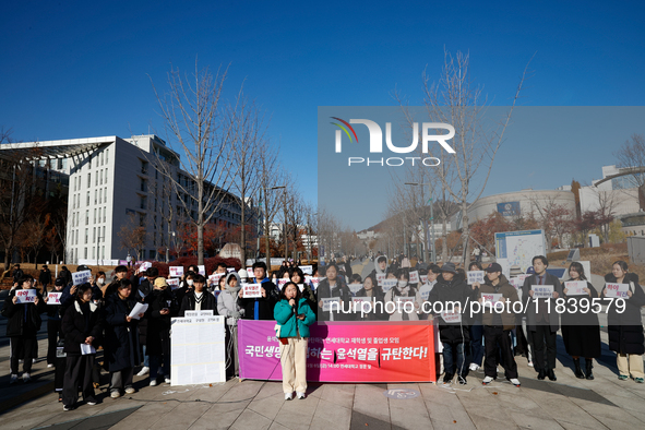 A group of dozens of current students and alumni from Yonsei University holds a press conference condemning President Yoon Suk-yeol's martia...