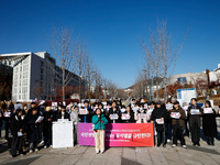 A group of dozens of current students and alumni from Yonsei University holds a press conference condemning President Yoon Suk-yeol's martia...