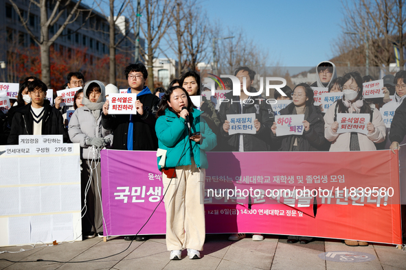 A group of dozens of current students and alumni from Yonsei University holds a press conference condemning President Yoon Suk-yeol's martia...