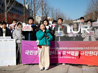 A group of dozens of current students and alumni from Yonsei University holds a press conference condemning President Yoon Suk-yeol's martia...